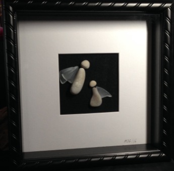 Stone Angels with glass wings. Framed in 10"x10" shadow box frame