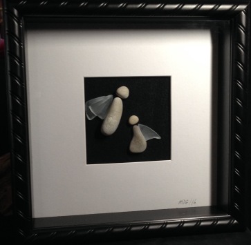 Stone Angels with glass wings. Framed in 10"x10" shadow box frame