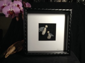 Stone Angels with glass wings framed in 10"x10" shadow box frame