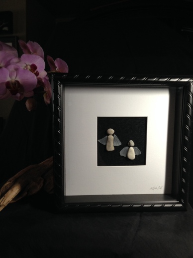 Stone Angels with glass wings. Framed in 10"x10" shadow boxes