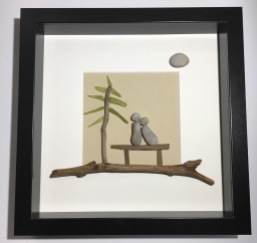 Couple on Bench. Features driftwood and glass tree.