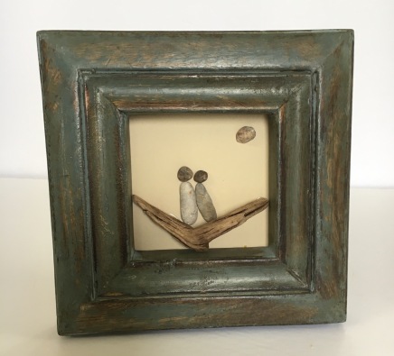 Couple on driftwood in rustic green frame
