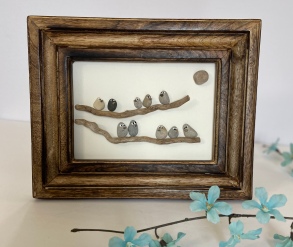 Birds on branches, brown wood frame